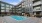 a swimming pool in a courtyard between buildings